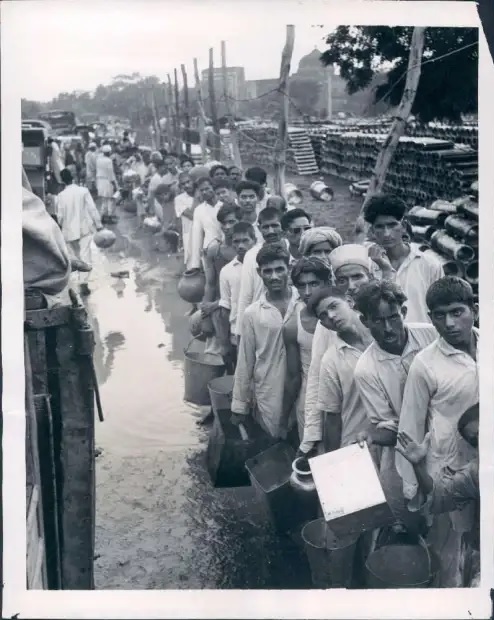 Refugees at a camp in Delhi waiting in line for water -A news photo from 1947 - Source - Wikimedia Commons