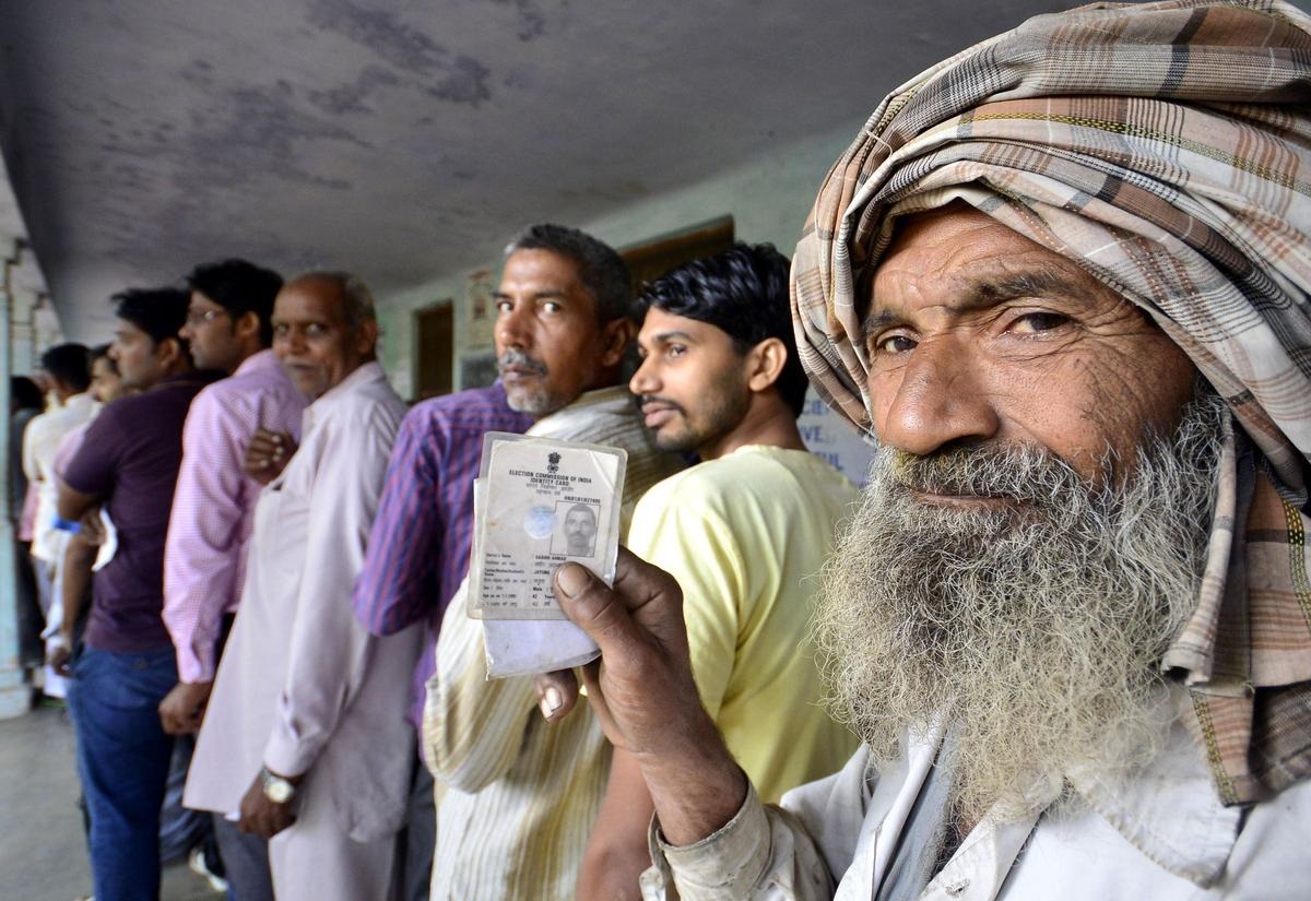 Voters queued up to use their franchise during Haryana assembly elections outside a polling booth near Panchkula | Photo Credit: AKHILESH KUMAR/The Hindu